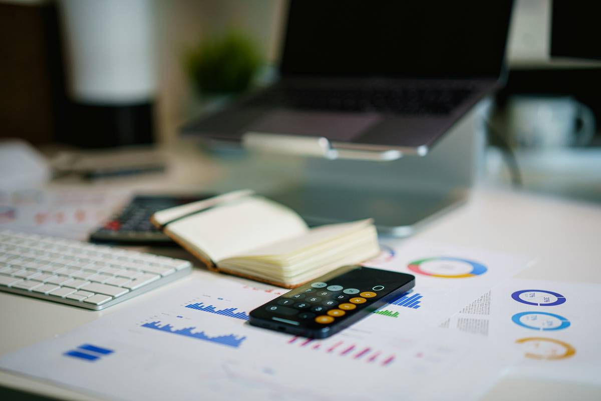 financial planning unlimited illustrated with a clear path through scattered coins and financial charts